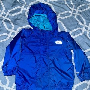 The North Face blue windbreaker jacket